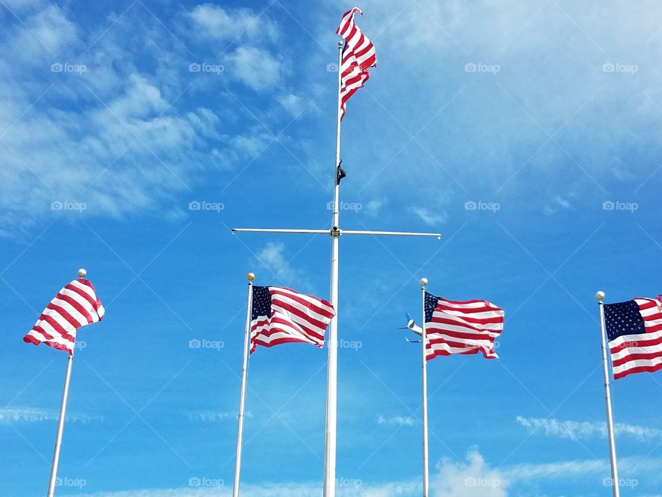 Flag poles fly at Elizabeth, nj waterfront