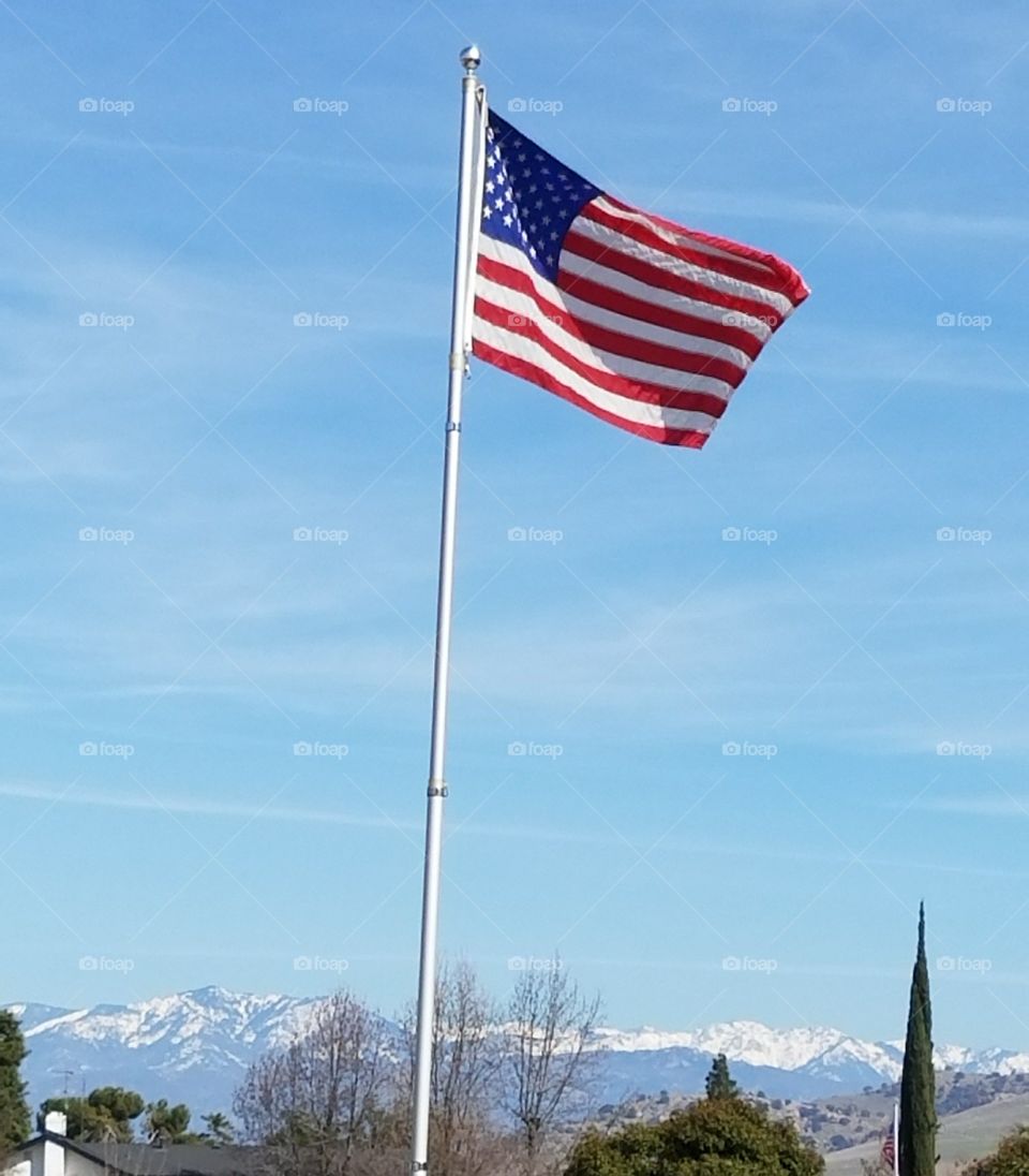United States flag snow on mountains