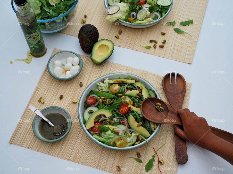 Table filled with salad and vegetables 