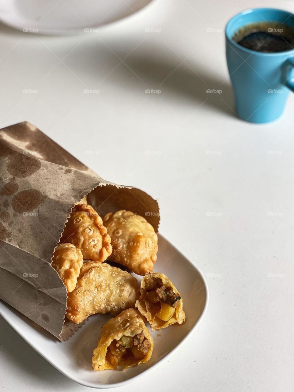 Curry puff on the white plate.