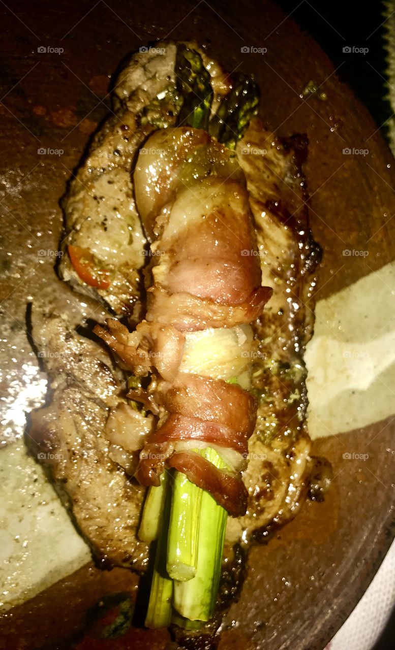 Bacon, bacon wrapped asparagus, bacon asparagus tree, New York strip, steak, carnival, medium rare, perfectly cooked, culinary, delicious, gourmet, dinner, charbroiled, red meat, beef, pork,