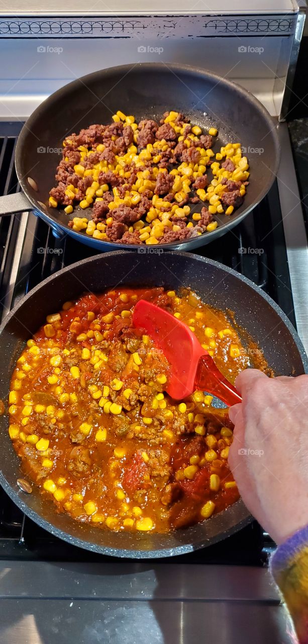 Recipe: Sauteed ground meat, corn & tomato sauce. Simmer until cooked. You'll love how this combination tastes on pasta!