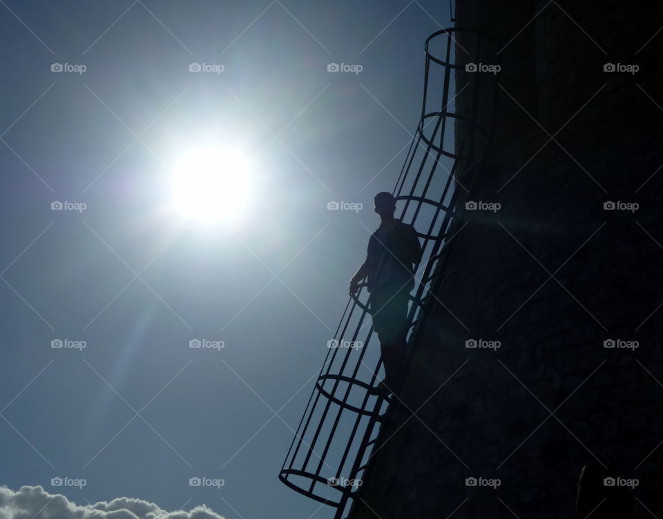 person in a castle cage