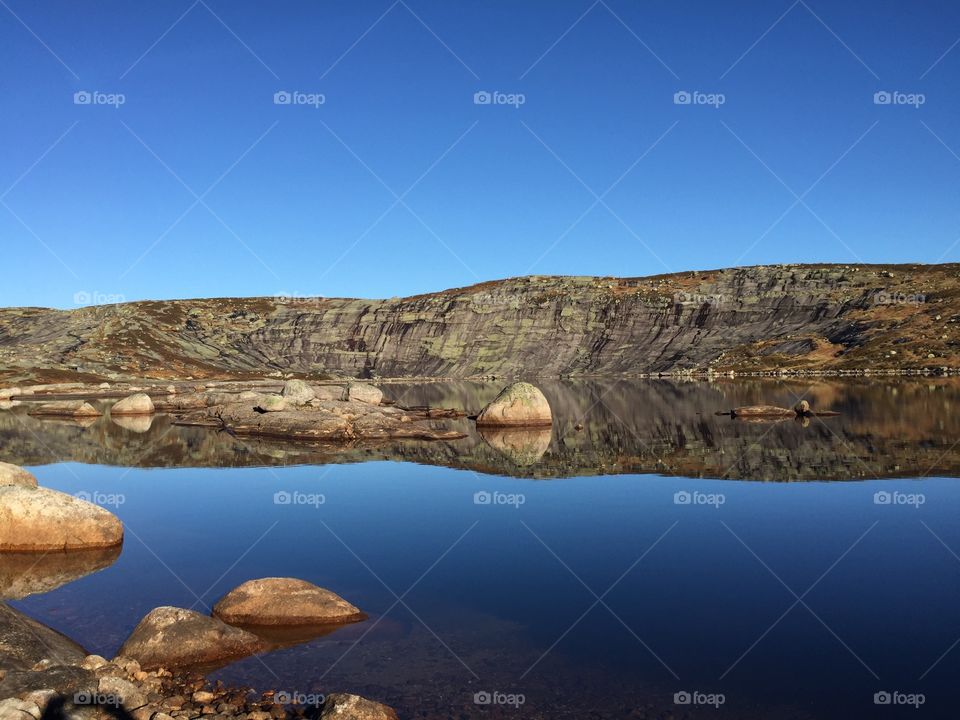 Blue sky reflected in lake
