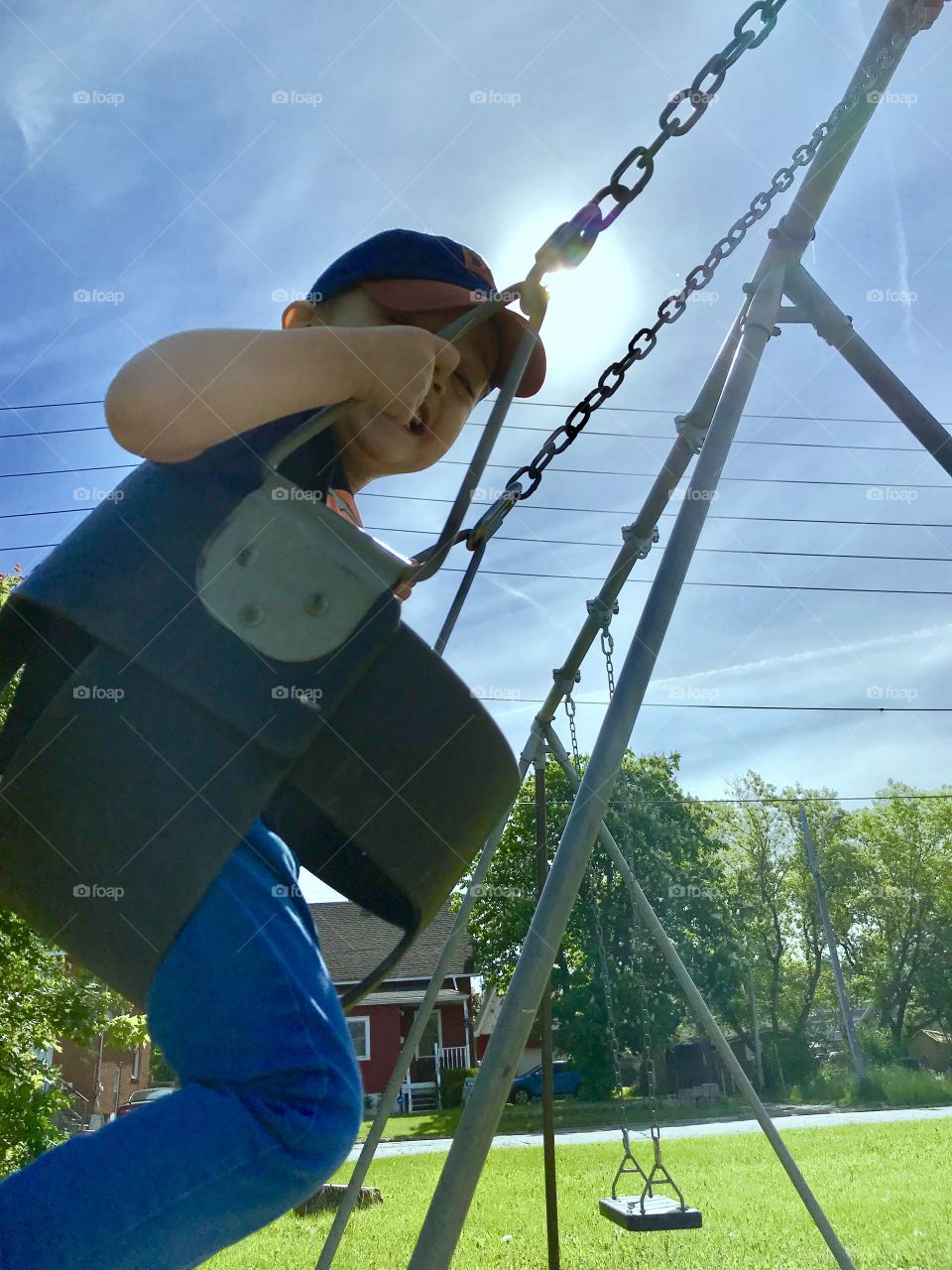Child laughing while swinging