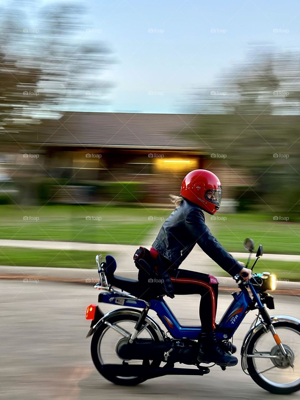 Girl with the red helmet riding her scooter to the nearby store whizzed by me so quickly but not before I snapped her image!