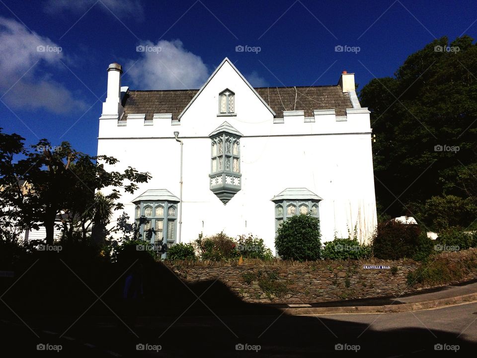 Clean edges, blue sky and a home 