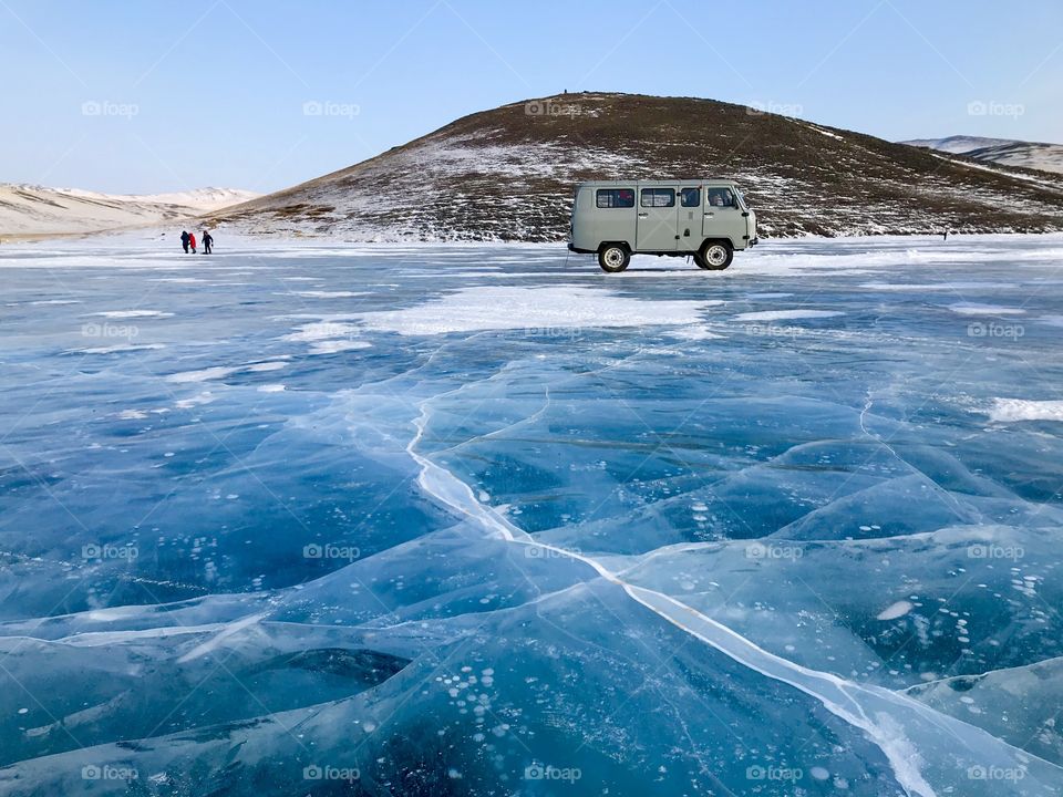 Cute van on ice layer where the bubble were. Love the line and pattern that approach to the van and hill.