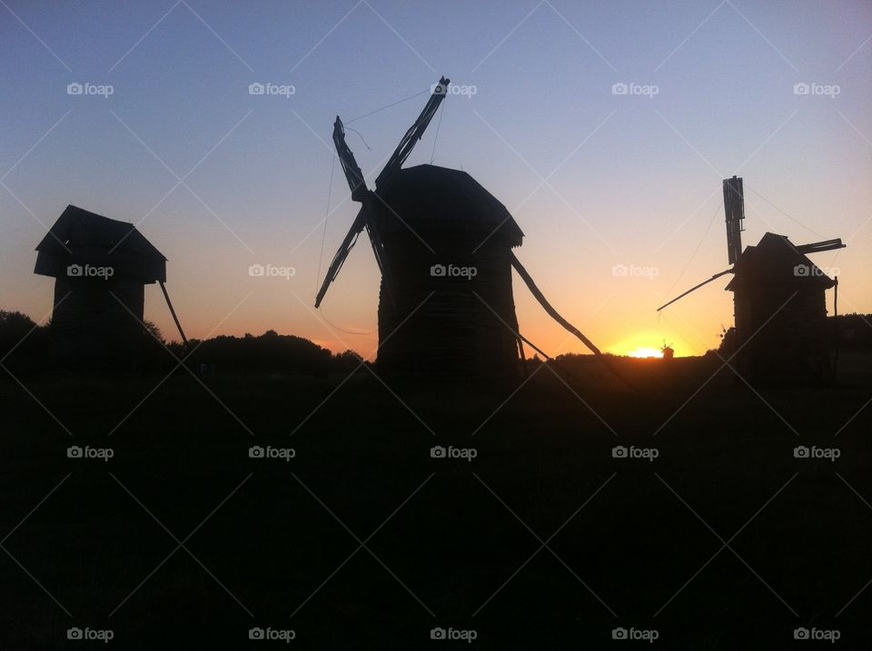 Windmills on the sunset back. Windmill 