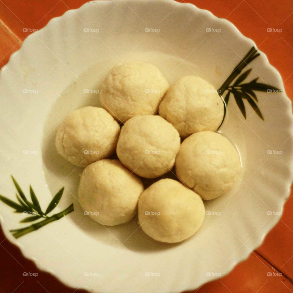 Rasagola, Rasgulla or Roshogolla is a South Asian syrupy dessert popular in the Indian subcontinent and regions with South Asian diaspora. It is made from ball-shaped dumplings of chhena and semolina dough, cooked in light suger syrup.