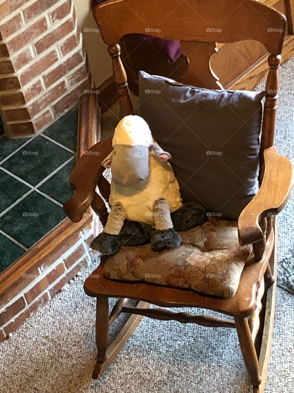 Toy lamb in rocking chair