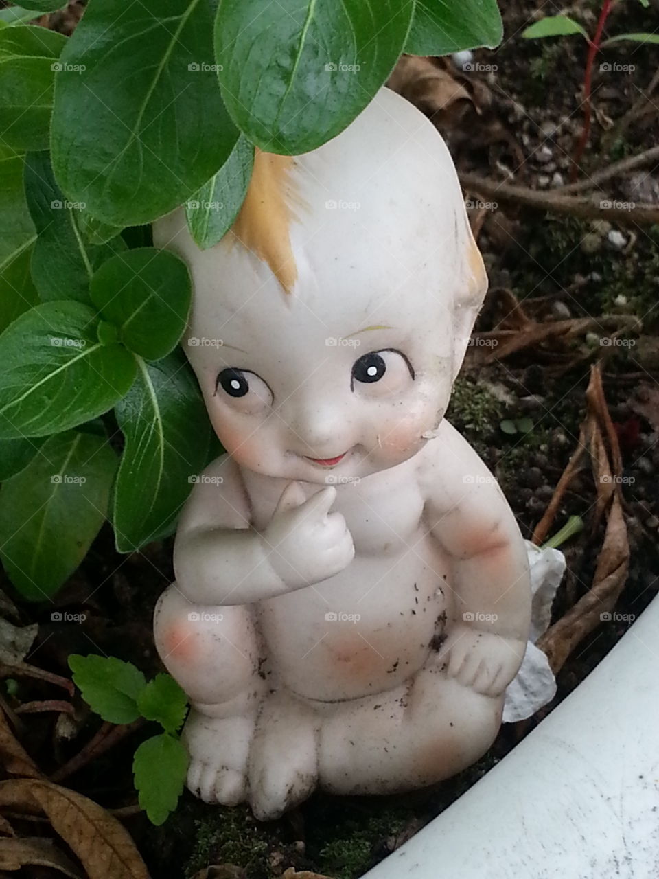 baby figurine. baby figurine in the garden