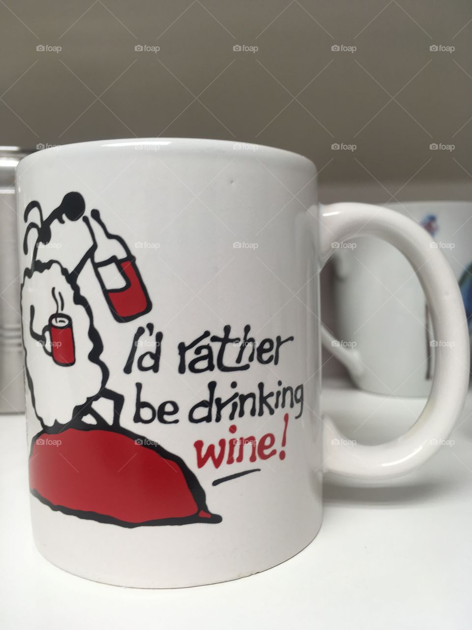 Coffee mug with wording that is exclaiming to rather be drinking wine