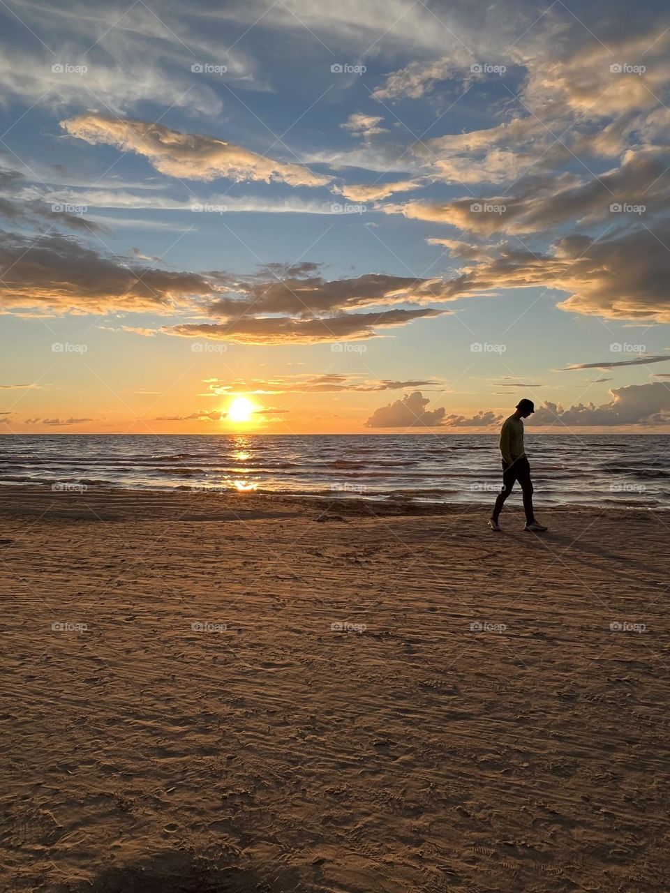 Beautiful sunset on the beach. Summer time, nice summer evening.