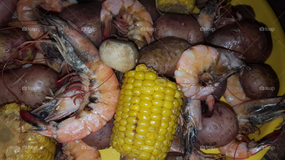 shrimp book with corn potatoes and onions