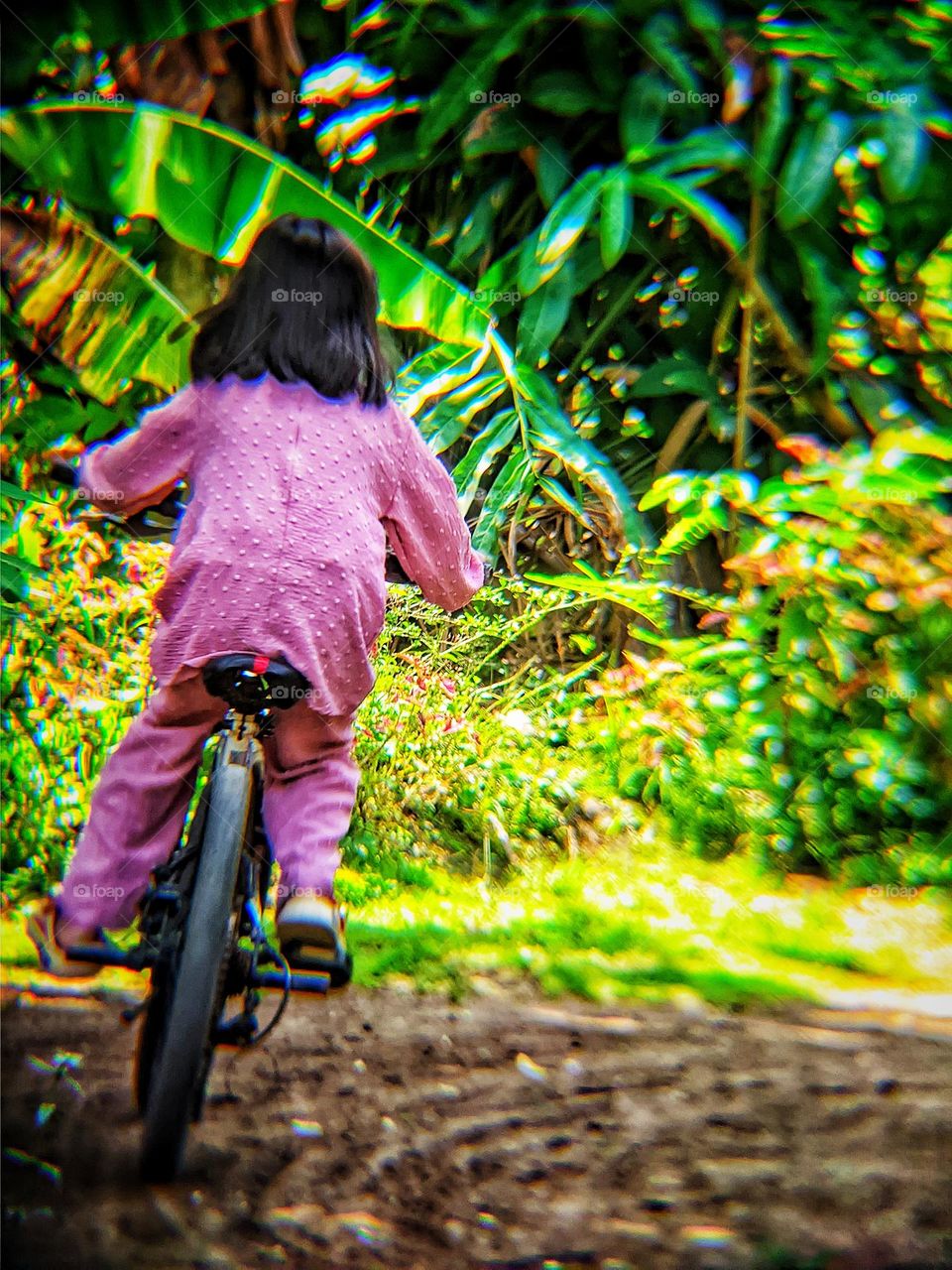 little girl riding a bicycle