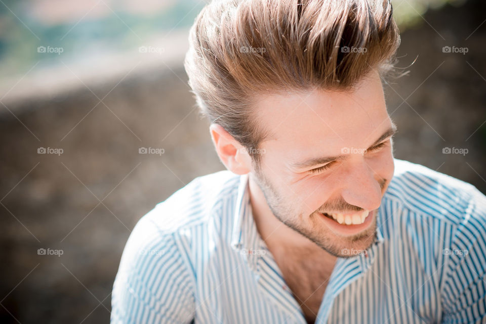 handsome smiling happy candid young man 