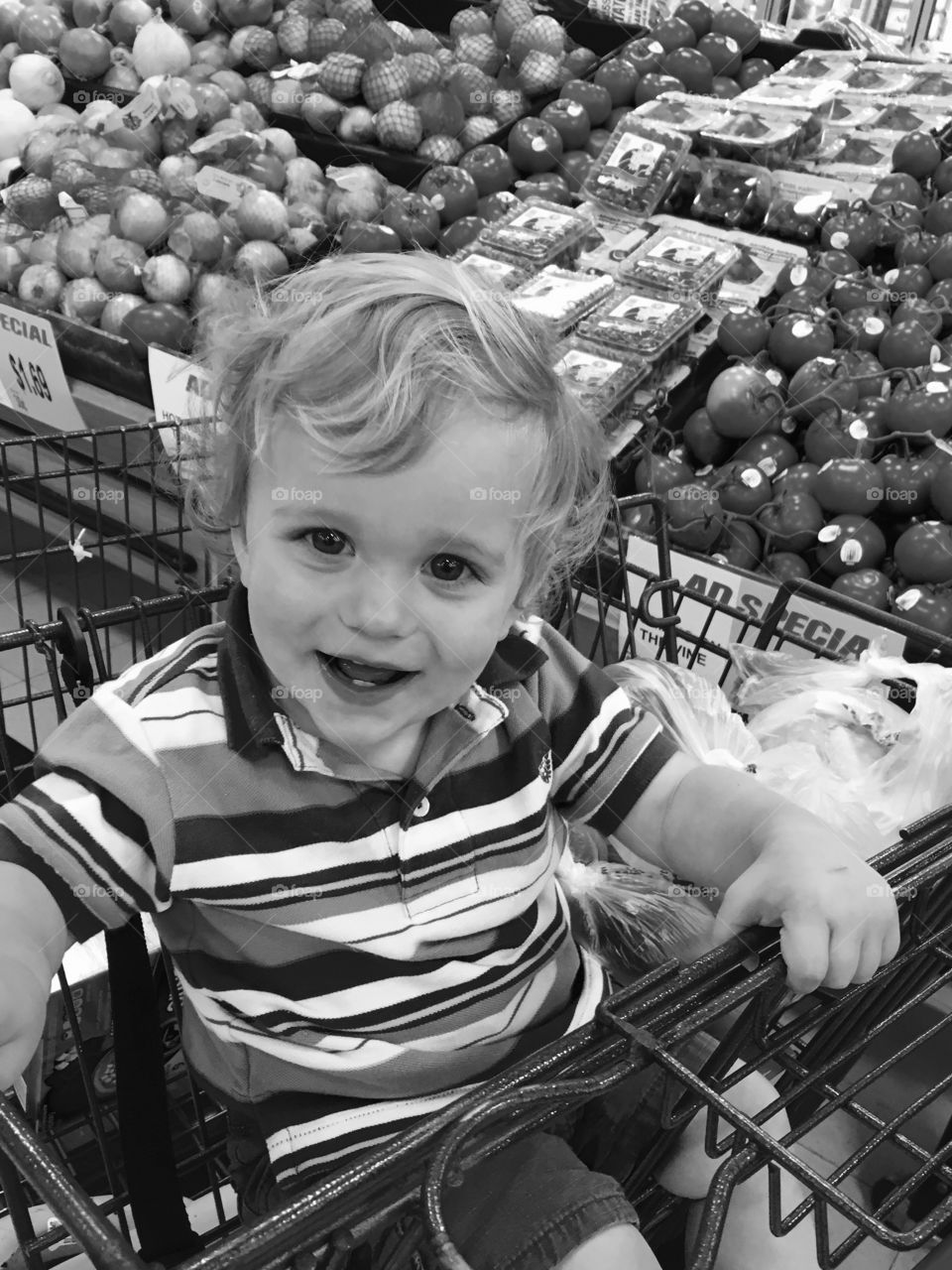 Happy child in a grocery store