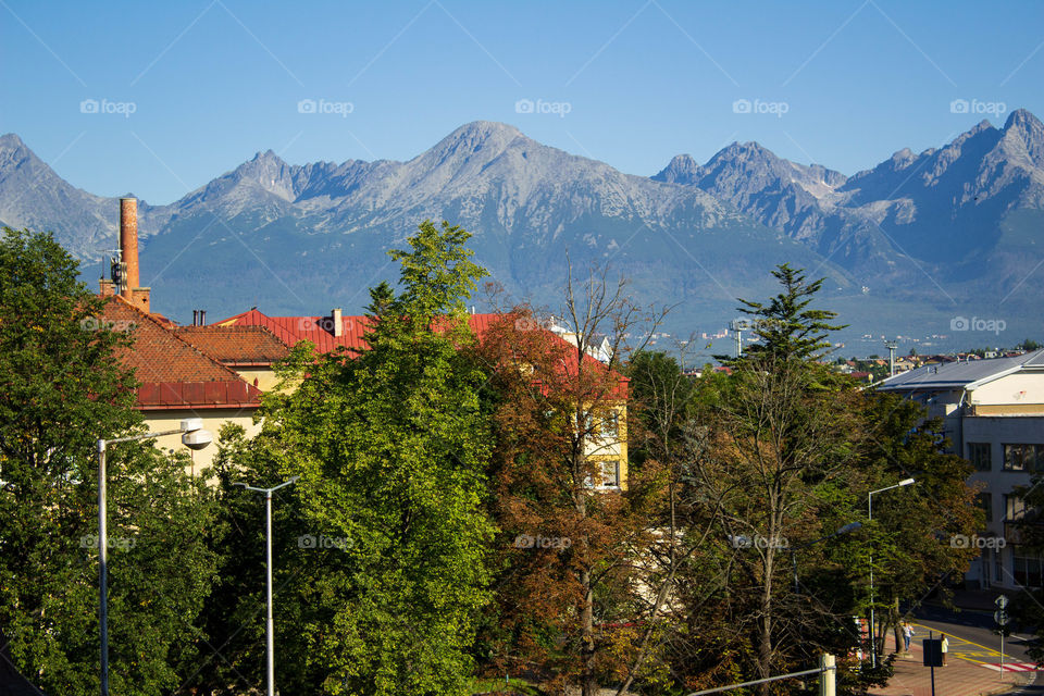 View from the window. Europe. Colorful houses. The mountains.