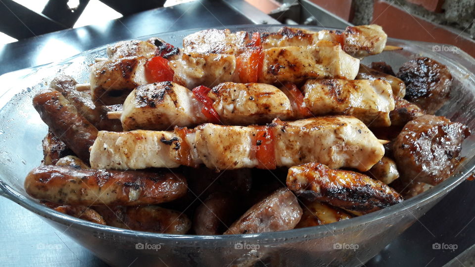 Bowl of meat on barbecue