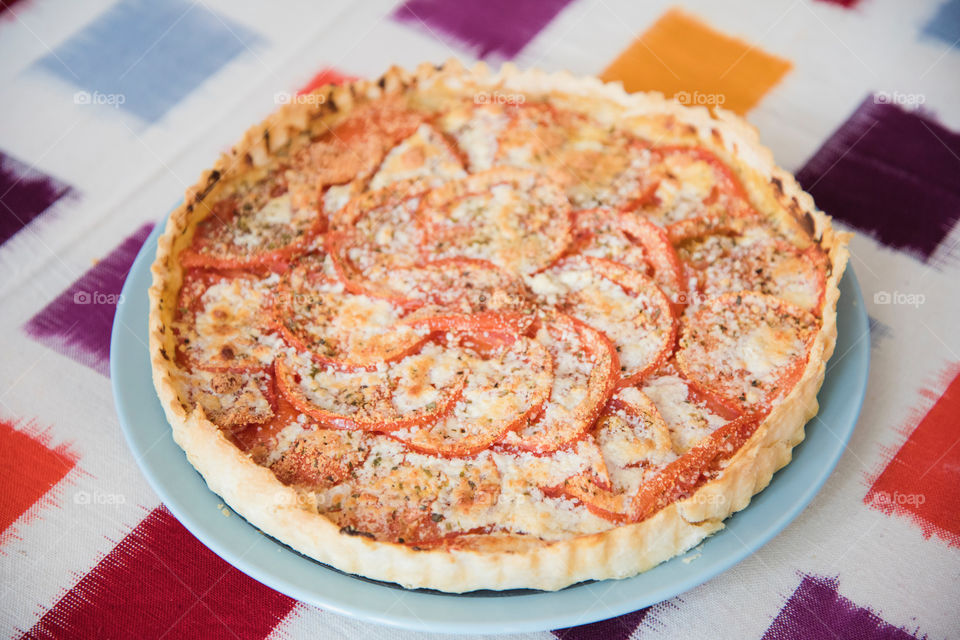 Tart desert with tomato served in plate