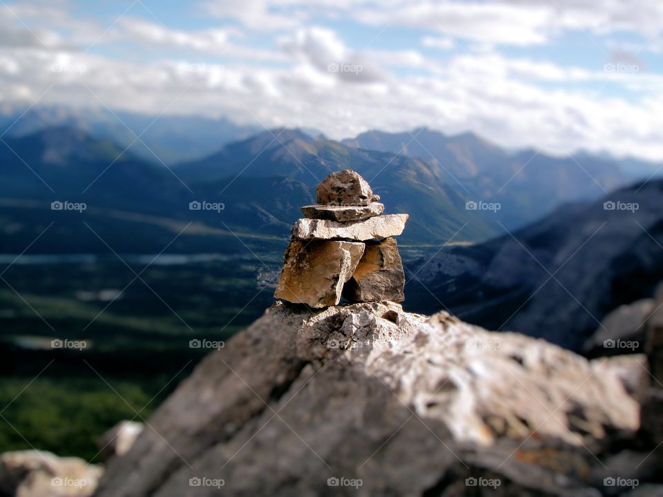 Inuksuk on top of Yamnuska Mountain, Alberta, Canada