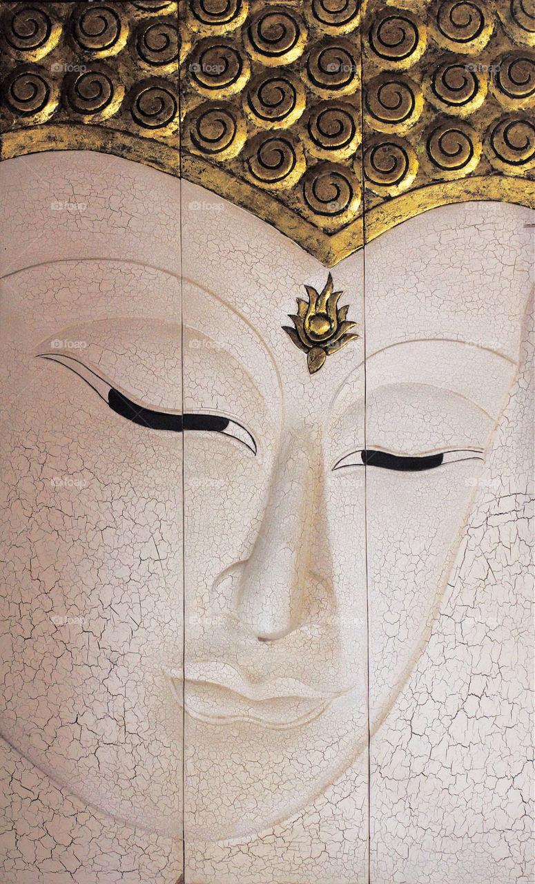Wooden Buddha face