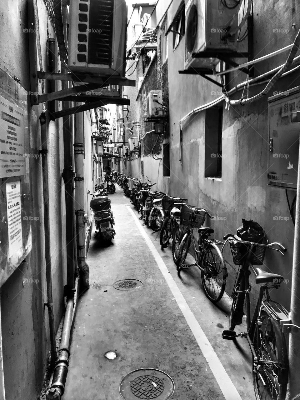 Xintiandi back alley - and you thought the bicycles have all gone having been replaced by scooters.... well they are still here 