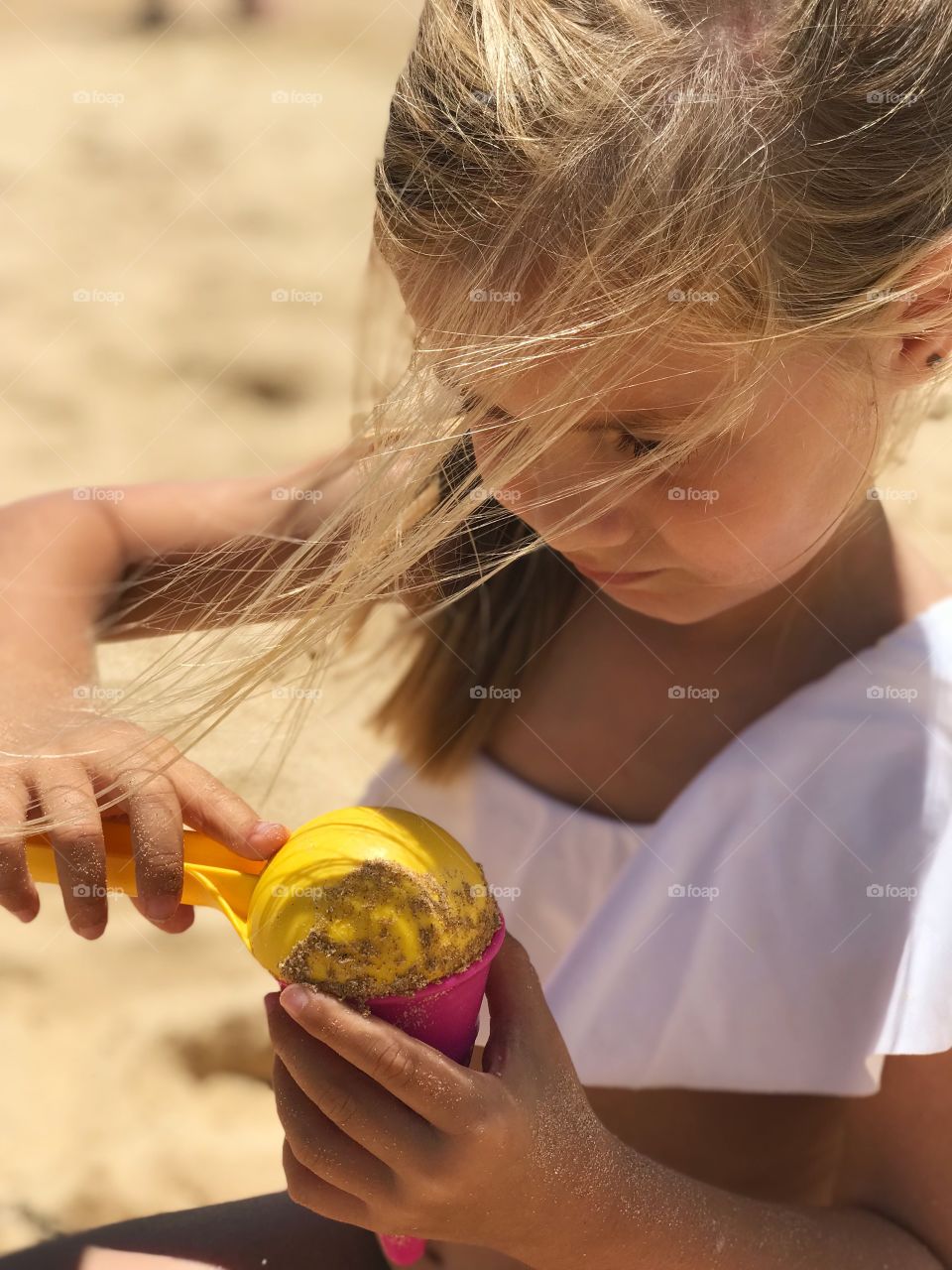Child playing with sand