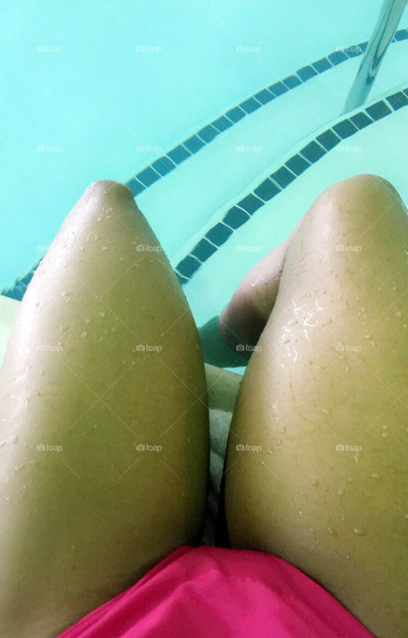 Sexy lady black girl wet legs from the pool