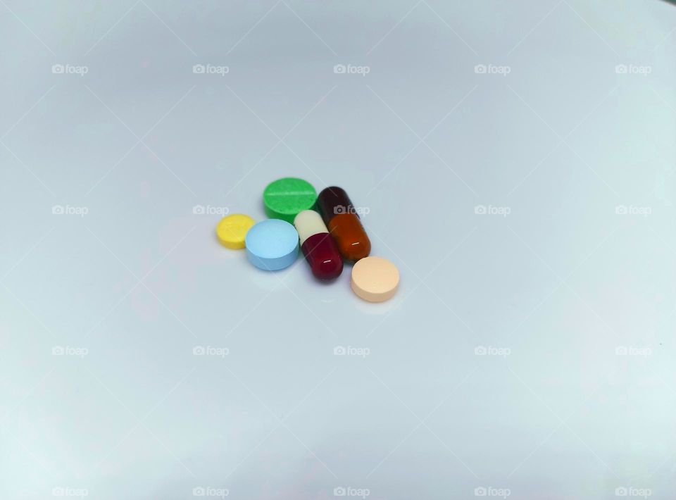 Medicines with variant shapes, colors on a white background, Drugs