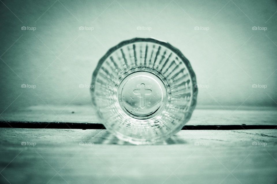 The bottom of a mezcal glass in vignette.