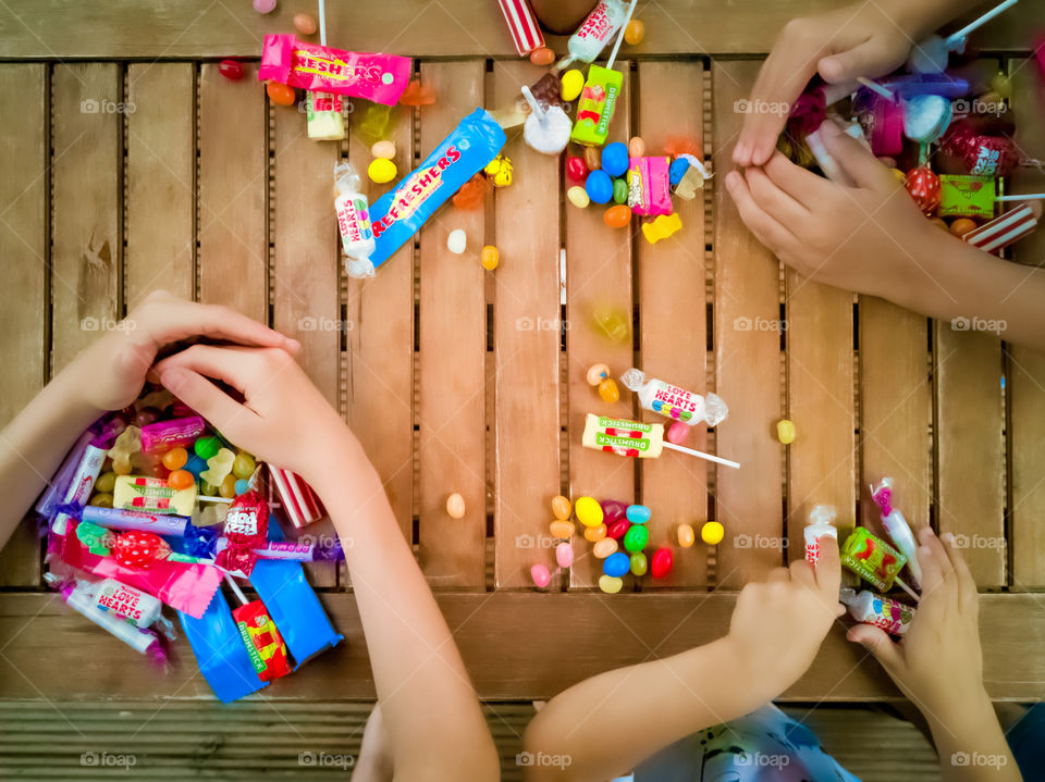 Little hands on their sweets.