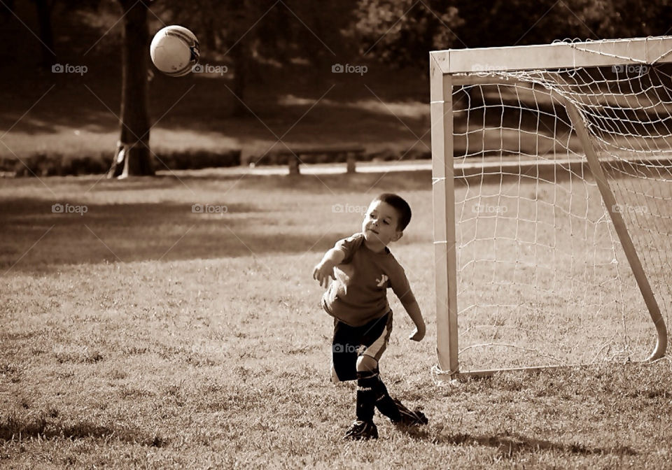 My handsome little man saving his team by blocking a goal while