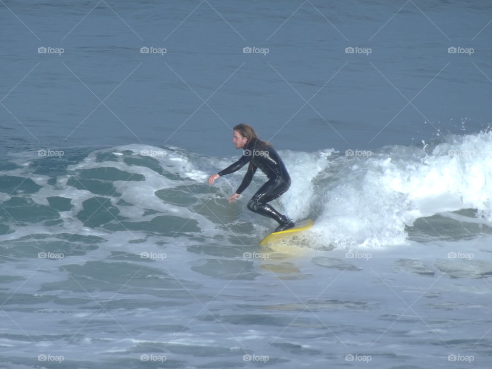 surfer Bamburgh beach northumberland