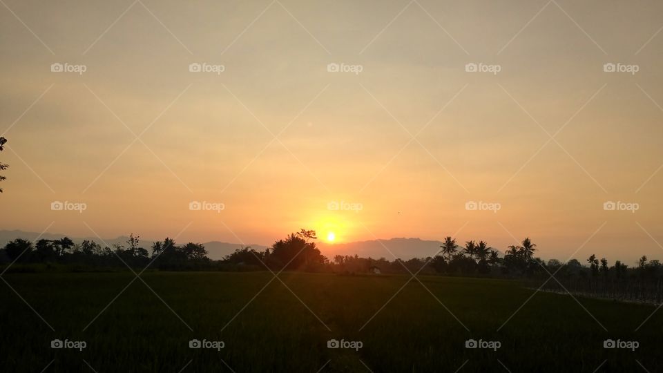 beauty sunset behind mountain