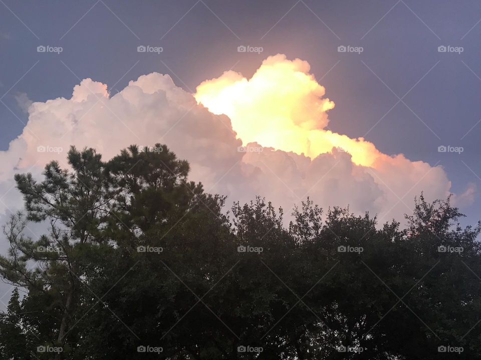 Amazing thunder storm coming to Katy TX, sunset brightens top of the cloud