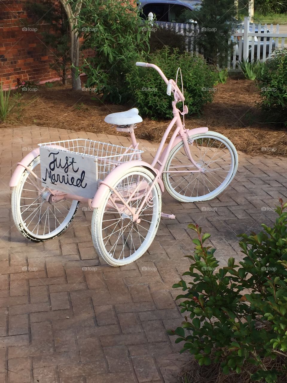 White tricycle with just married text