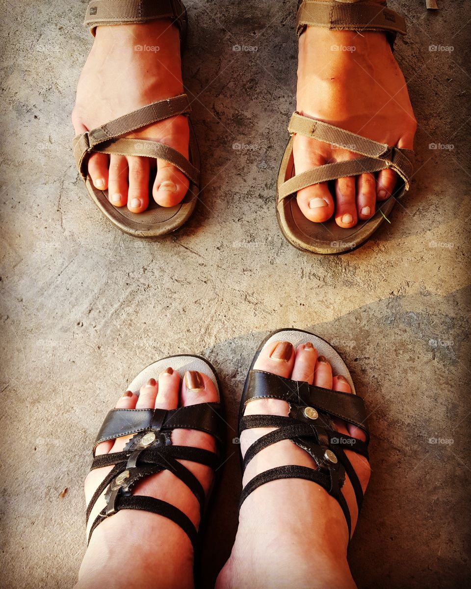 Mother and daughter's feet give clues to the paths that life has taken them.