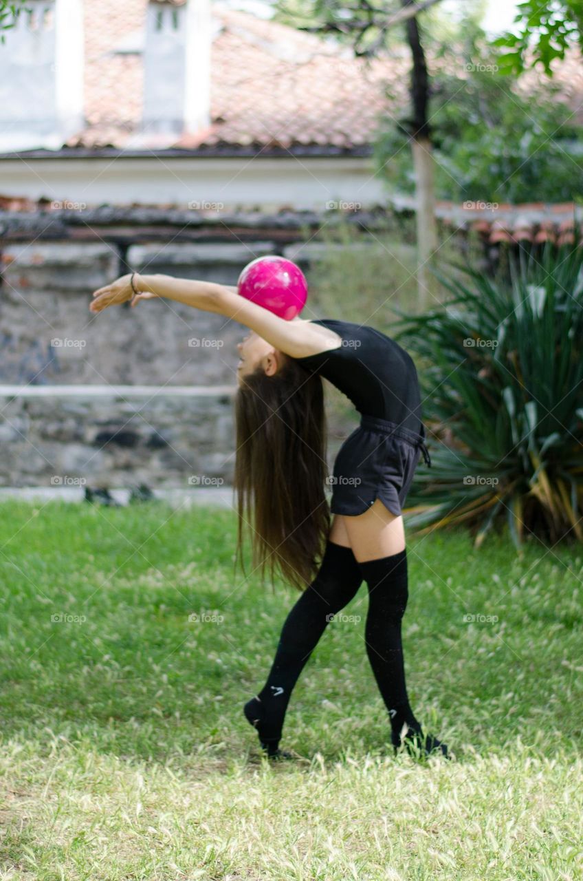 Beautiful Young Gimnast Dancing in Nature