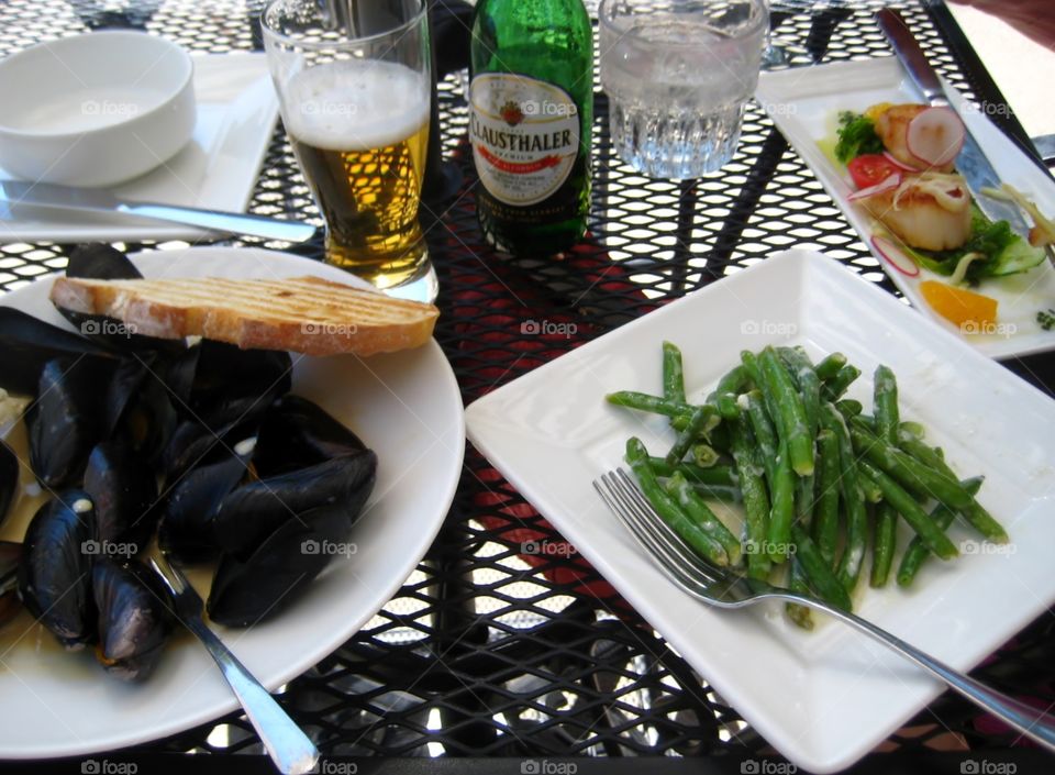Lunching Al Fresco. Mussels and More on Lattice Table