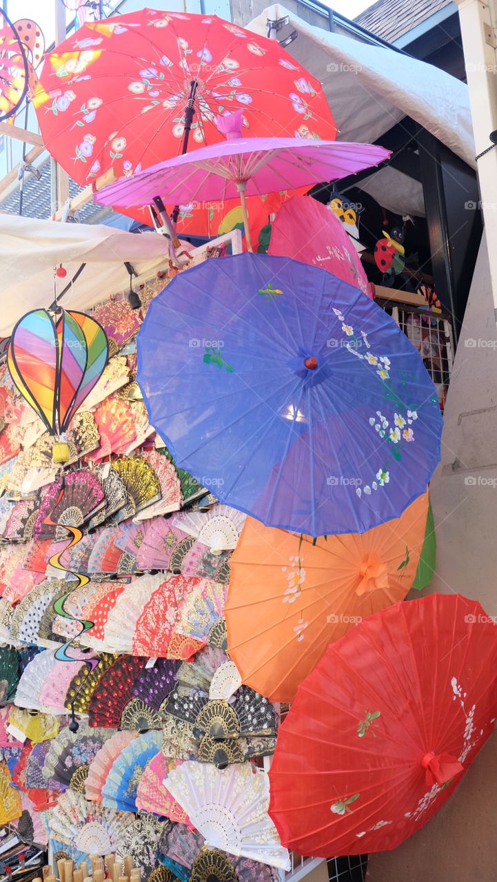 Market stall, Paper umbrellas, hand fan and wind mill