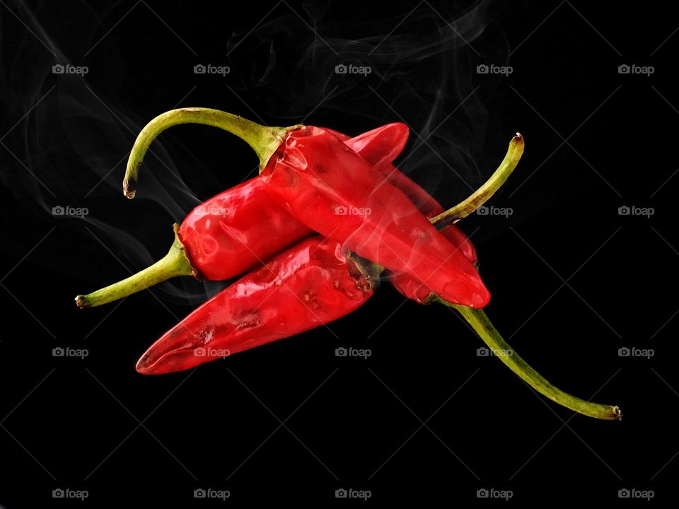 Chilli peppers in black background

