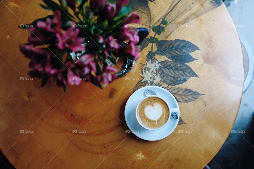Coffee and flowers in the afternoon light.