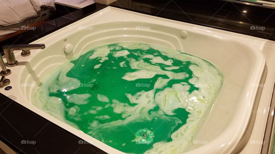 green Jacuzzi bathtub from a bath bomb