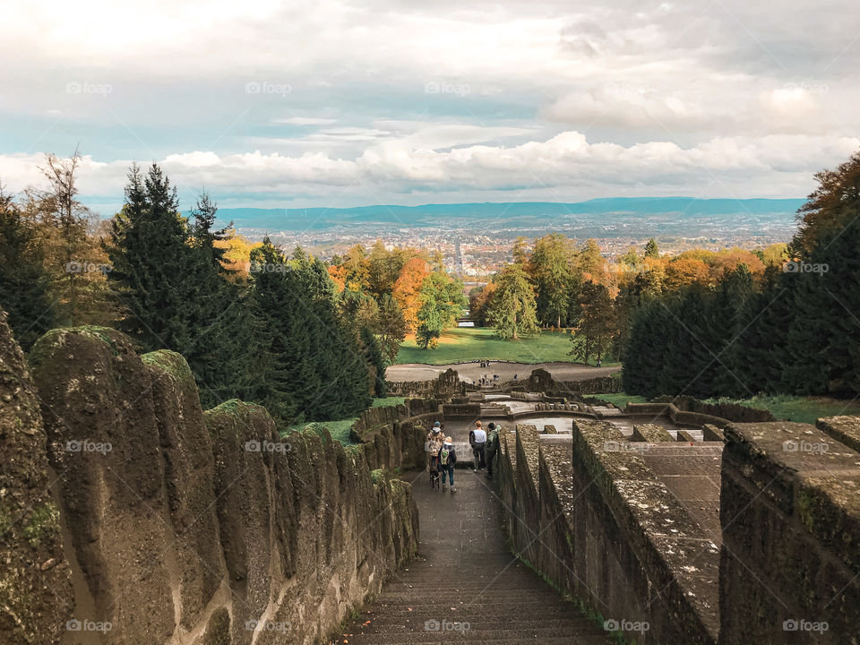 The trees in the fall . Autumn landscape. Forest. Stone constructions with many layers . clouds. changing color. Tourism in Europe 