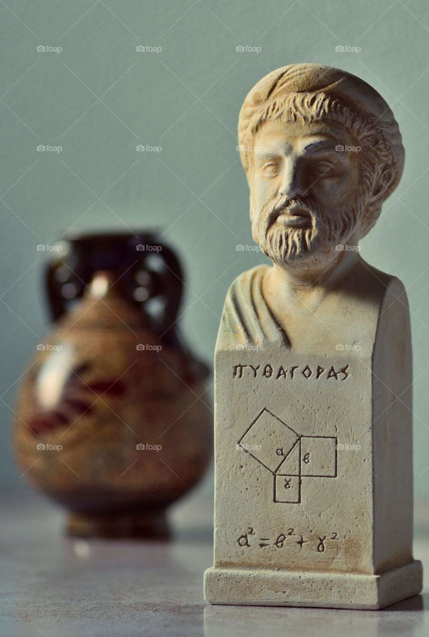 Bust of Pythagoras and clay pot in the background