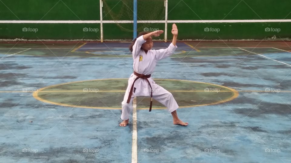 a young girl exercise karate