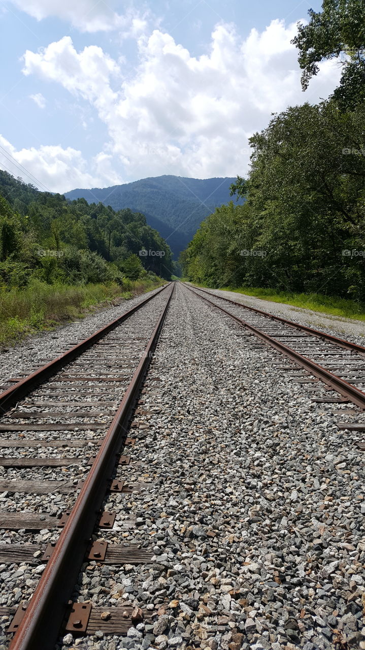 Railroad Tracks Through Mountains