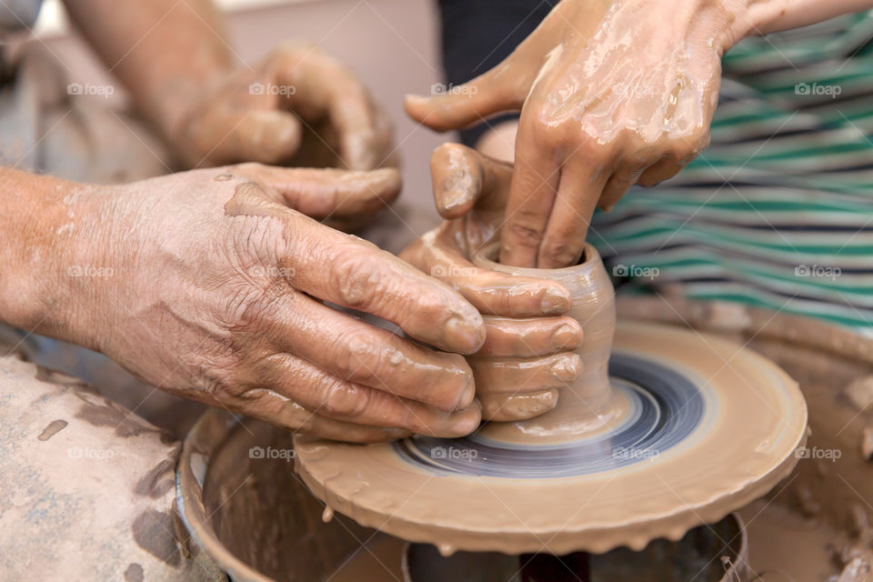 Pottery making. Closeup on hands.